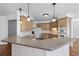 Well-equipped kitchen features stainless steel appliances, light wood cabinets and peninsula seating at 2405 Millwater Xing, Dacula, GA 30019