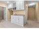 Finished basement kitchenette featuring white cabinets, microwave, sink, and wine rack at 2405 Millwater Xing, Dacula, GA 30019