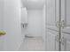 Well-lit laundry room with tile floors, lots of storage, and washer-dryer hookups at 2405 Millwater Xing, Dacula, GA 30019