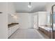 Bright bathroom with double vanity, soaking tub, and tiled floors at 2405 Millwater Xing, Dacula, GA 30019