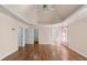 Spacious main bedroom featuring tray ceiling, hardwood floors, and an ensuite bathroom at 2405 Millwater Xing, Dacula, GA 30019