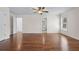 Large main bedroom with en-suite bathroom, wood floors, and large windows at 2405 Millwater Xing, Dacula, GA 30019