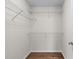 Walk-in closet with wire shelving and hardwood floors at 2405 Millwater Xing, Dacula, GA 30019