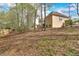 View of the backyard and house with new fencing at 4162 Crowder Nw Dr, Kennesaw, GA 30152