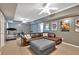 Finished basement showcasing a spacious area for relaxation and fitness, complete with a sectional and treadmill at 4162 Crowder Nw Dr, Kennesaw, GA 30152