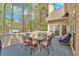 Inviting outdoor deck with dining furniture perfect for relaxation, with a clear view of the backyard at 4162 Crowder Nw Dr, Kennesaw, GA 30152