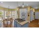 Eat-in kitchen with island gas cooktop, adjacent breakfast nook, and double wall oven at 4162 Crowder Nw Dr, Kennesaw, GA 30152