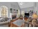 Bright living room with fireplace, vaulted ceiling, and large windows at 4162 Crowder Nw Dr, Kennesaw, GA 30152