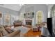 Cozy living room features a fireplace, hardwood floors, and lots of natural light at 4162 Crowder Nw Dr, Kennesaw, GA 30152