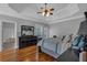 Primary bedroom boasts a trey ceiling, hardwood floors, and large windows at 4162 Crowder Nw Dr, Kennesaw, GA 30152