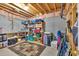 Unfinished basement featuring exposed rafters and framing, equipped with shelving, a bike, and storage containers at 4162 Crowder Nw Dr, Kennesaw, GA 30152