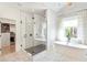 Bright bathroom featuring a soaking tub, glass shower, walk-in closet, and elegant tile flooring at 1299 Sunland Ne Dr, Brookhaven, GA 30319