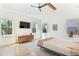 Bright bedroom featuring a beamed ceiling, modern furnishings, and large windows providing ample natural light at 1299 Sunland Ne Dr, Brookhaven, GA 30319