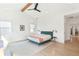 Spacious, bright bedroom with a beamed ceiling, large windows, and stylish minimalist furnishings at 1299 Sunland Ne Dr, Brookhaven, GA 30319