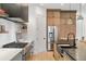 Modern kitchen with stainless steel appliances and black countertop at 1299 Sunland Ne Dr, Brookhaven, GA 30319