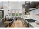 Contemporary kitchen with center island, stainless steel appliances and adjacent breakfast nook at 1299 Sunland Ne Dr, Brookhaven, GA 30319