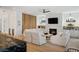 Living room featuring a fireplace, flat-screen tv, built-in shelves, and hardwood floors at 1299 Sunland Ne Dr, Brookhaven, GA 30319