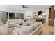 Open concept living room and kitchen with hardwood floors, a fireplace, and sliding glass doors to patio at 1299 Sunland Ne Dr, Brookhaven, GA 30319