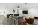 Finished basement living room with concrete floors and bar area at 1299 Sunland Ne Dr, Brookhaven, GA 30319