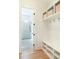 Bright mudroom featuring storage cubbies and a view into the shower, creating a convenient and stylish transition space at 1299 Sunland Ne Dr, Brookhaven, GA 30319