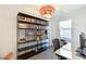 Bright office features large bookshelf, desk, and lots of natural light at 1299 Sunland Ne Dr, Brookhaven, GA 30319