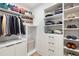 Spacious walk-in closet featuring ample shelving, drawers, and hanging space, providing organized storage at 1299 Sunland Ne Dr, Brookhaven, GA 30319