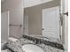 Modern bathroom with a granite-topped vanity and updated fixtures at 310 Ashigan St, Union City, GA 30291