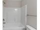 Bathroom featuring a clean shower-tub combo with modern showerhead at 310 Ashigan St, Union City, GA 30291