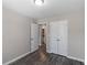Cozy bedroom with a view to bathroom and closet with hardwood flooring at 310 Ashigan St, Union City, GA 30291