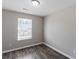 Bright bedroom with natural light, hardwood floors, and neutral paint at 310 Ashigan St, Union City, GA 30291