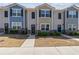 Attractive townhome exteriors with coordinated color schemes and inviting curb appeal at 310 Ashigan St, Union City, GA 30291