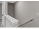 Upstairs hallway showcases neutral paint and carpeted flooring at 310 Ashigan St, Union City, GA 30291