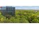 A close up view of a tree-filled landscape near the glass building at 3300 Windy Ridge Se Pkwy # 1309, Atlanta, GA 30339