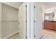 Bathroom with closet, double doors, vanity, sink and mirror at 3300 Windy Ridge Se Pkwy # 1309, Atlanta, GA 30339