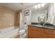 Modern bathroom with a tub-shower combo, granite countertop vanity, and decorative lighting at 3300 Windy Ridge Se Pkwy # 1309, Atlanta, GA 30339