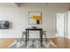 Dining area with black table, seating for two, modern art and light hardwood floors at 3300 Windy Ridge Se Pkwy # 1309, Atlanta, GA 30339