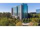 Striking high rise apartment building set among lush green trees during daylight at 3300 Windy Ridge Se Pkwy # 1309, Atlanta, GA 30339
