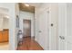 Hallway with hardwood floors, white trim, closet doors, and modern lighting at 3300 Windy Ridge Se Pkwy # 1309, Atlanta, GA 30339