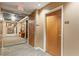 Condominium hallway featuring neutral carpeting and wood doors numbered 1309 at 3300 Windy Ridge Se Pkwy # 1309, Atlanta, GA 30339