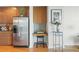 Kitchen area featuring stainless refrigerator, desk nook, and ample cabinet space at 3300 Windy Ridge Se Pkwy # 1309, Atlanta, GA 30339