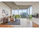 Bright living room with hardwood floors, concrete ceilings, and expansive windows at 3300 Windy Ridge Se Pkwy # 1309, Atlanta, GA 30339