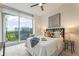 Bright bedroom featuring a large window with a view and stylish decor at 3300 Windy Ridge Se Pkwy # 1309, Atlanta, GA 30339