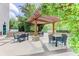 Outdoor patio area with pergola and several dining tables for entertaining at 3300 Windy Ridge Se Pkwy # 1309, Atlanta, GA 30339
