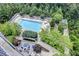 Stunning aerial view of the pool area with lush landscaping and lounge chairs at 3300 Windy Ridge Se Pkwy # 1309, Atlanta, GA 30339