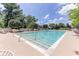 Inviting pool featuring a shallow end, surrounded by lounge seating and mature trees at 3300 Windy Ridge Se Pkwy # 1309, Atlanta, GA 30339