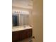 Bathroom with a wide mirror and vanity lighting at 470 Teal Ct, Roswell, GA 30076
