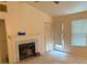 Cozy living room with a fireplace and natural light from the window at 470 Teal Ct, Roswell, GA 30076