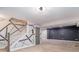 Spacious basement with unique wall design, carpeted flooring, and modern lighting at 1972 Cambridge Ave, Atlanta, GA 30337