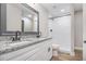 This primary bathroom features a double sink vanity with granite counters and a tiled shower at 1972 Cambridge Ave, Atlanta, GA 30337