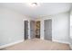 Bright bedroom with neutral carpet, white walls, and modern gray doors for a serene and inviting space at 1972 Cambridge Ave, Atlanta, GA 30337